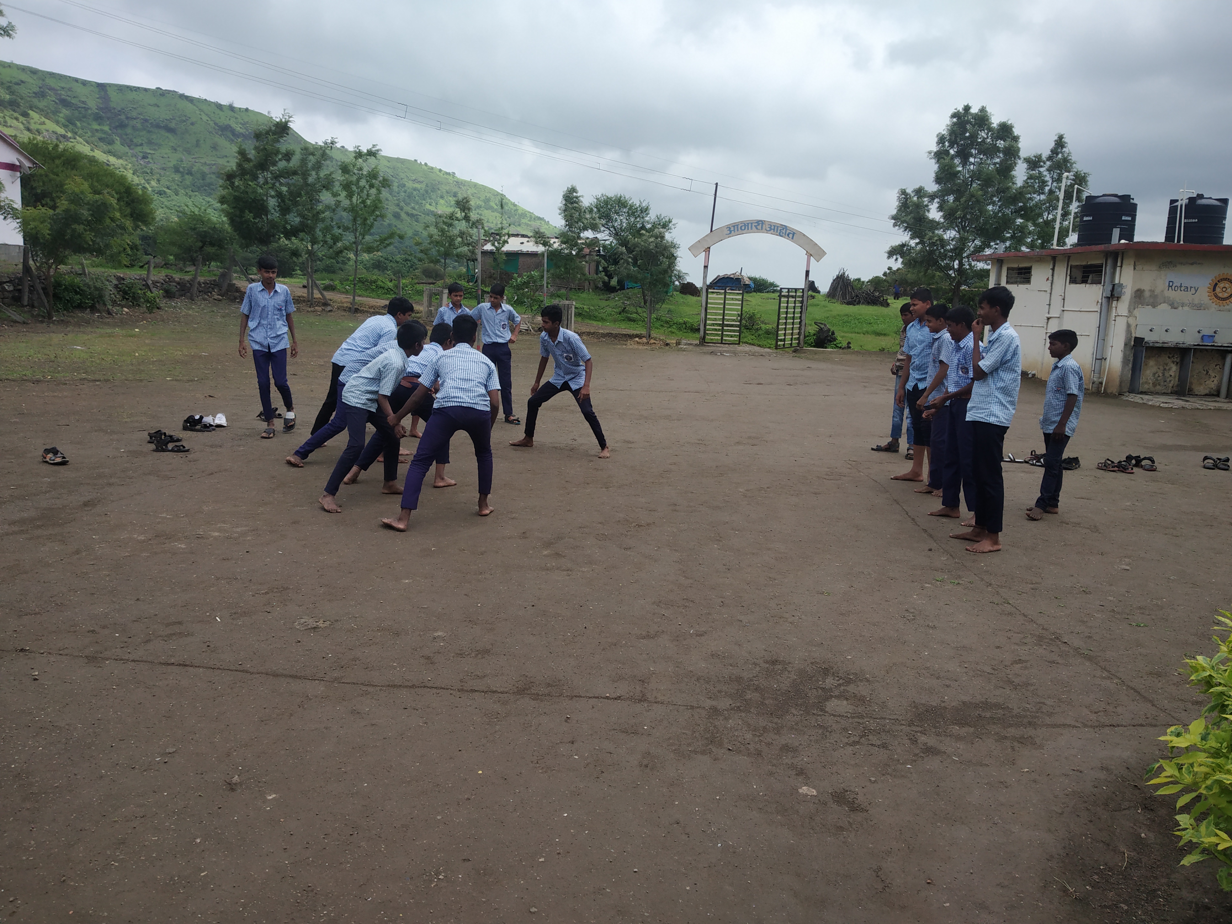 BOYS ARE PLAYING CABADI ON SCHOOL GROUND.